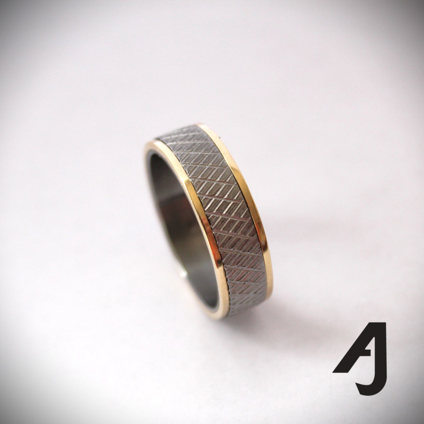 Gold and knurled steel ring