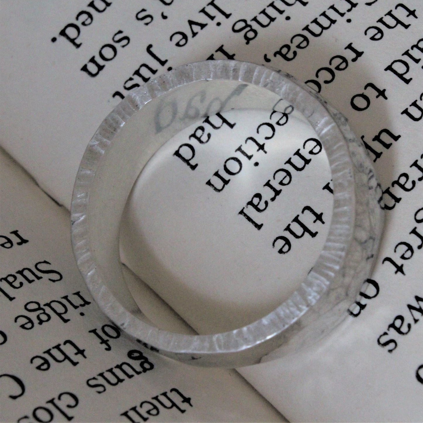 Hand-forged ring crafted from a solid piece of sterling silver with a hammer tone finish. This unique, one-of-a-kind piece features exceptional craftsmanship, intricate detailing, and a polished surface