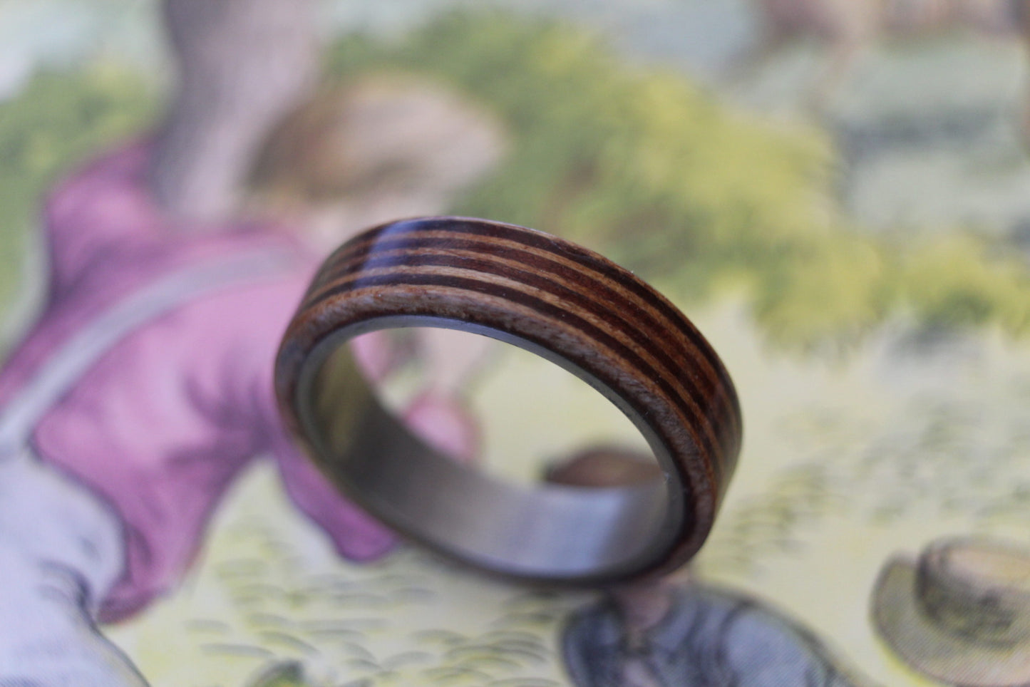 Akley Jewellers Australian Queensland maple and Victorian river redgum into to wrap band made of aircraft grade titanium.