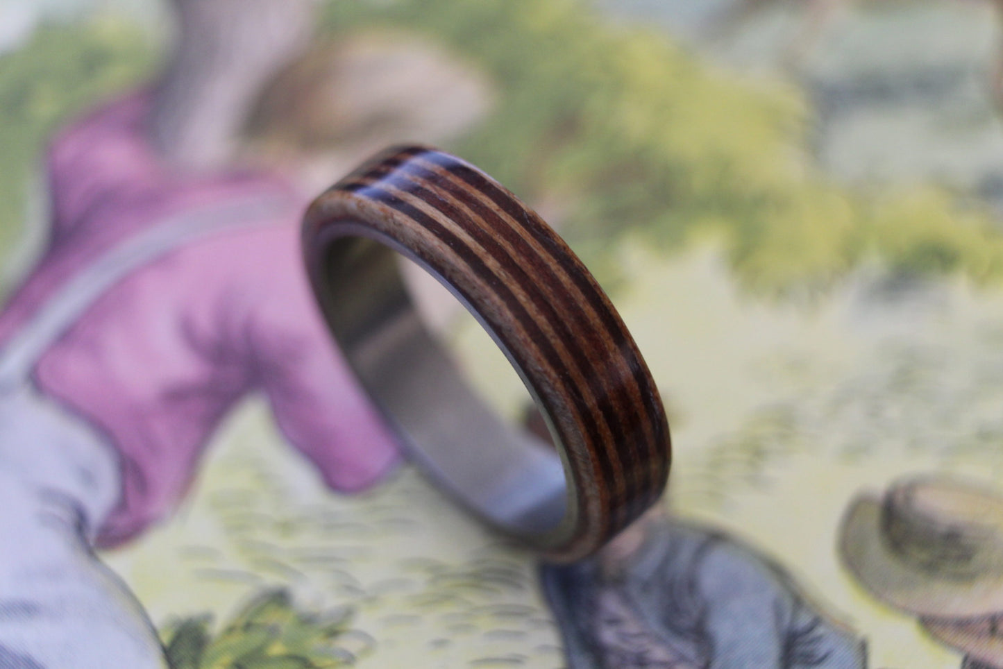 Akley Jewellers Australian Queensland maple and Victorian river redgum into to wrap band made of aircraft grade titanium.
