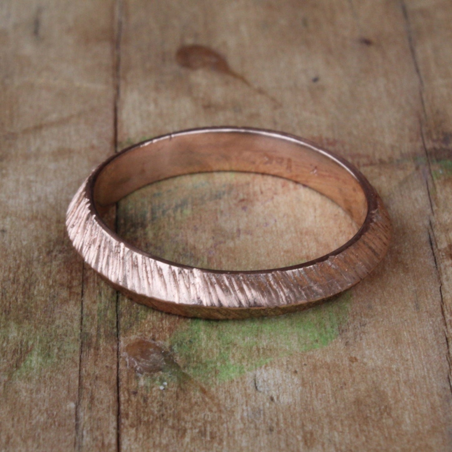 One-of-a-kind unisex ring crafted from 18ct rose/pink gold, featuring a distinctive ripple texture and rounded edges for comfort
