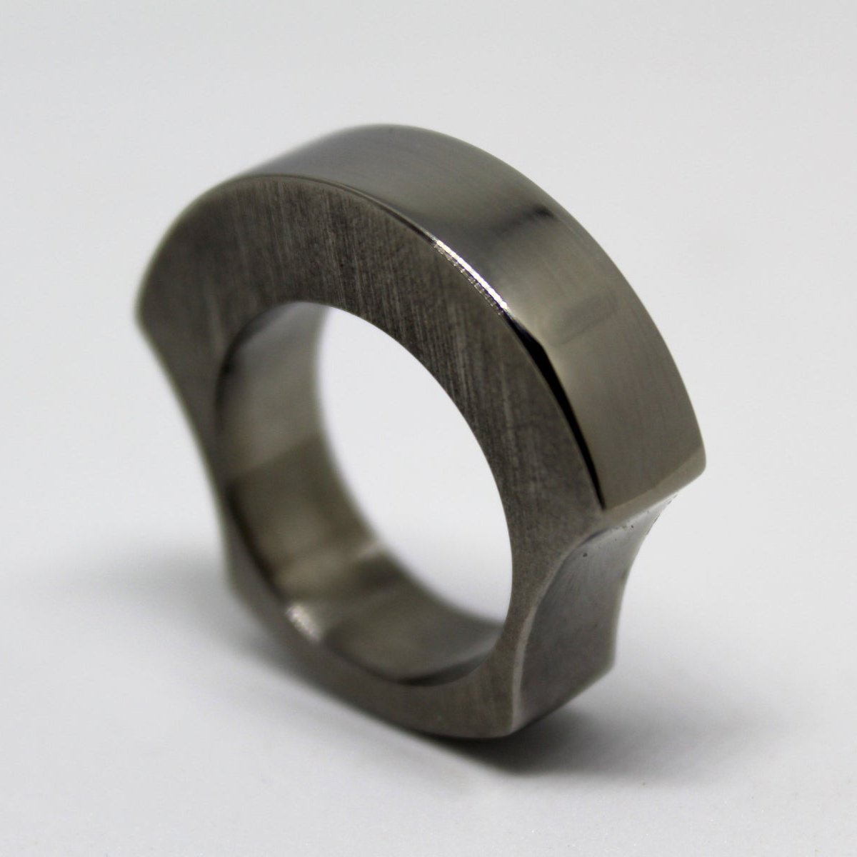 Solid titanium ring ergonomically designed for comfort, featuring a chunky appearance without bulk. Ideal for everyday wear, combining style and functionality for modern jewelry lovers.