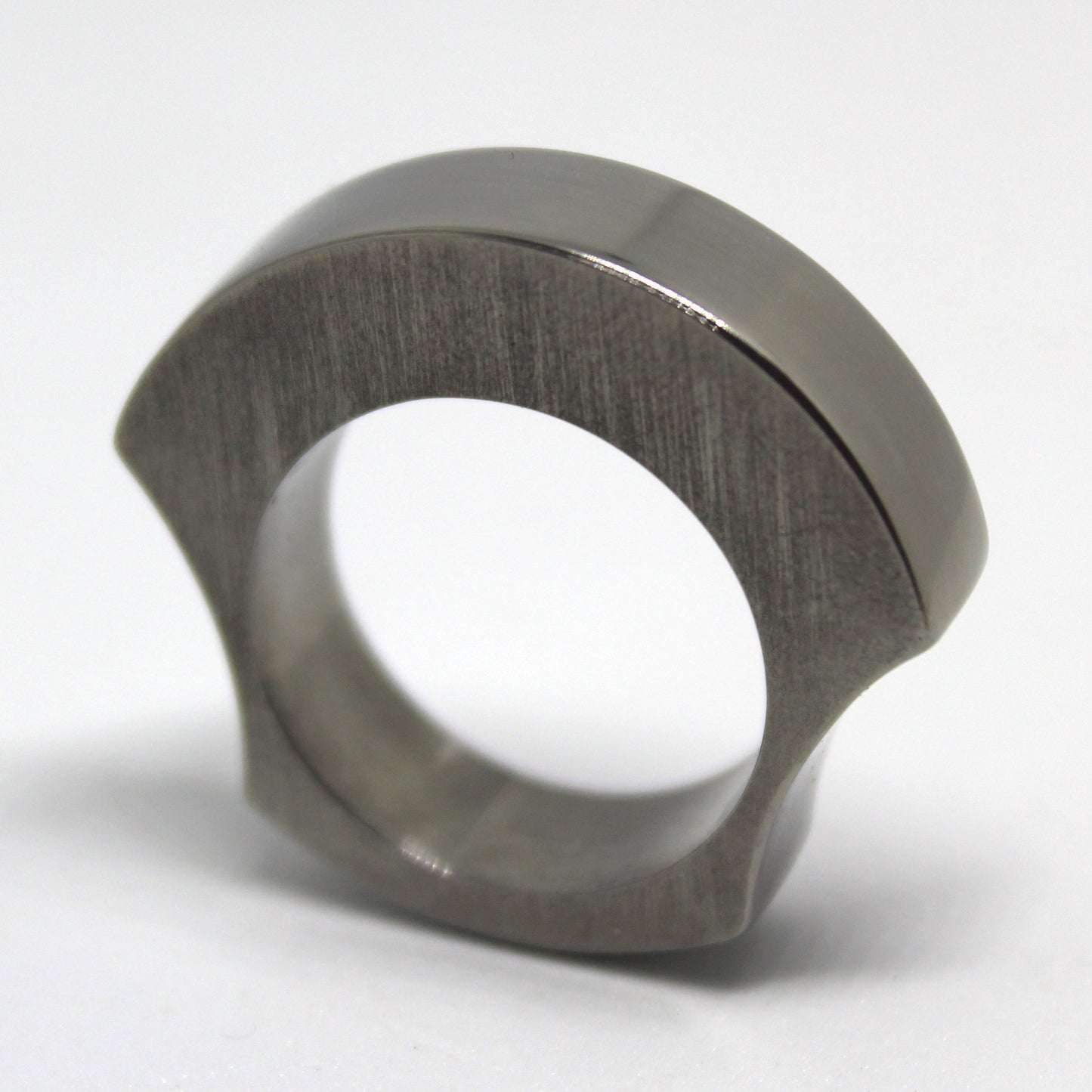Solid titanium ring ergonomically designed for comfort, featuring a chunky appearance without bulk. Ideal for everyday wear, combining style and functionality for modern jewelry lovers.