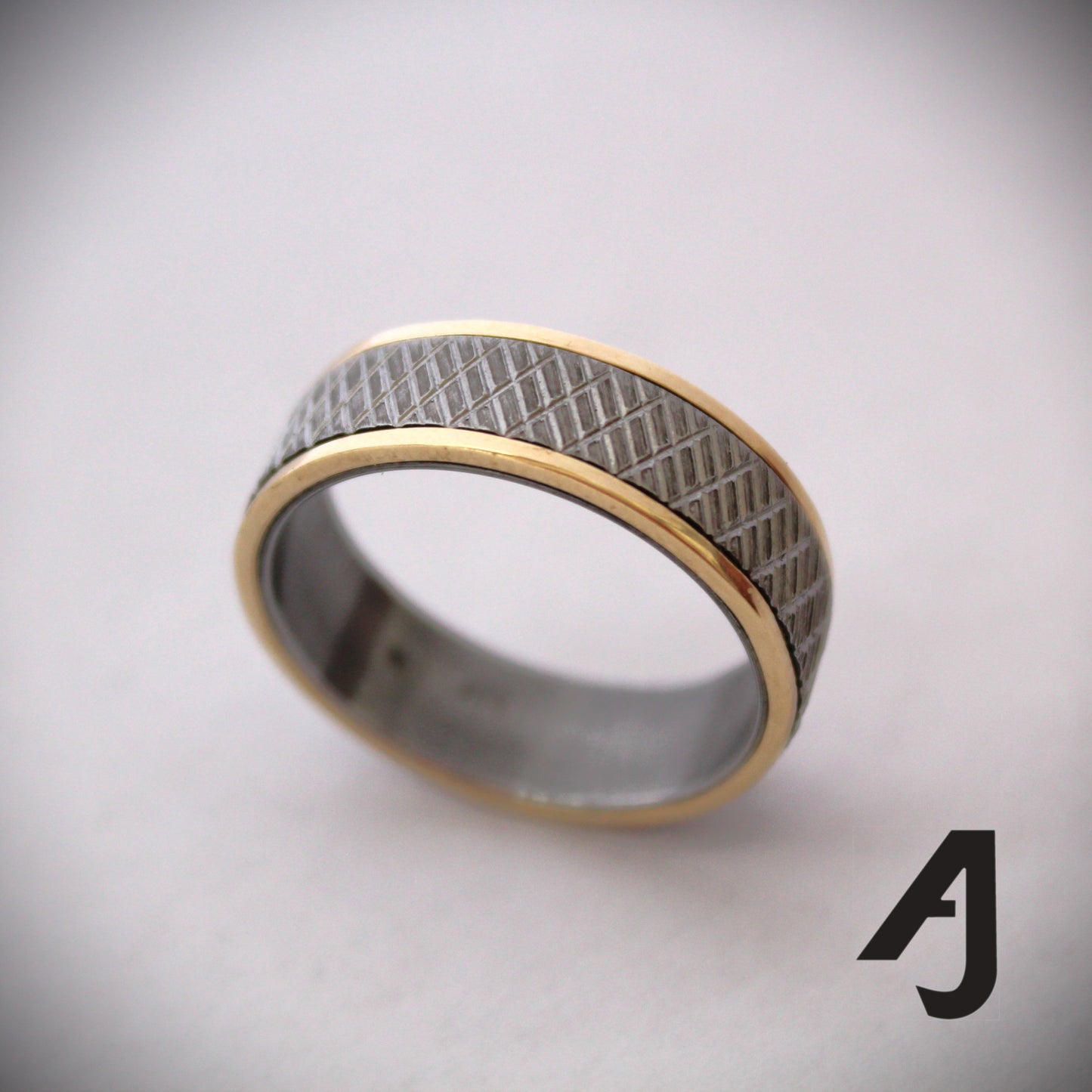 Gold and knurled steel ring