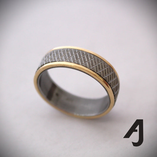 Gold and knurled steel ring