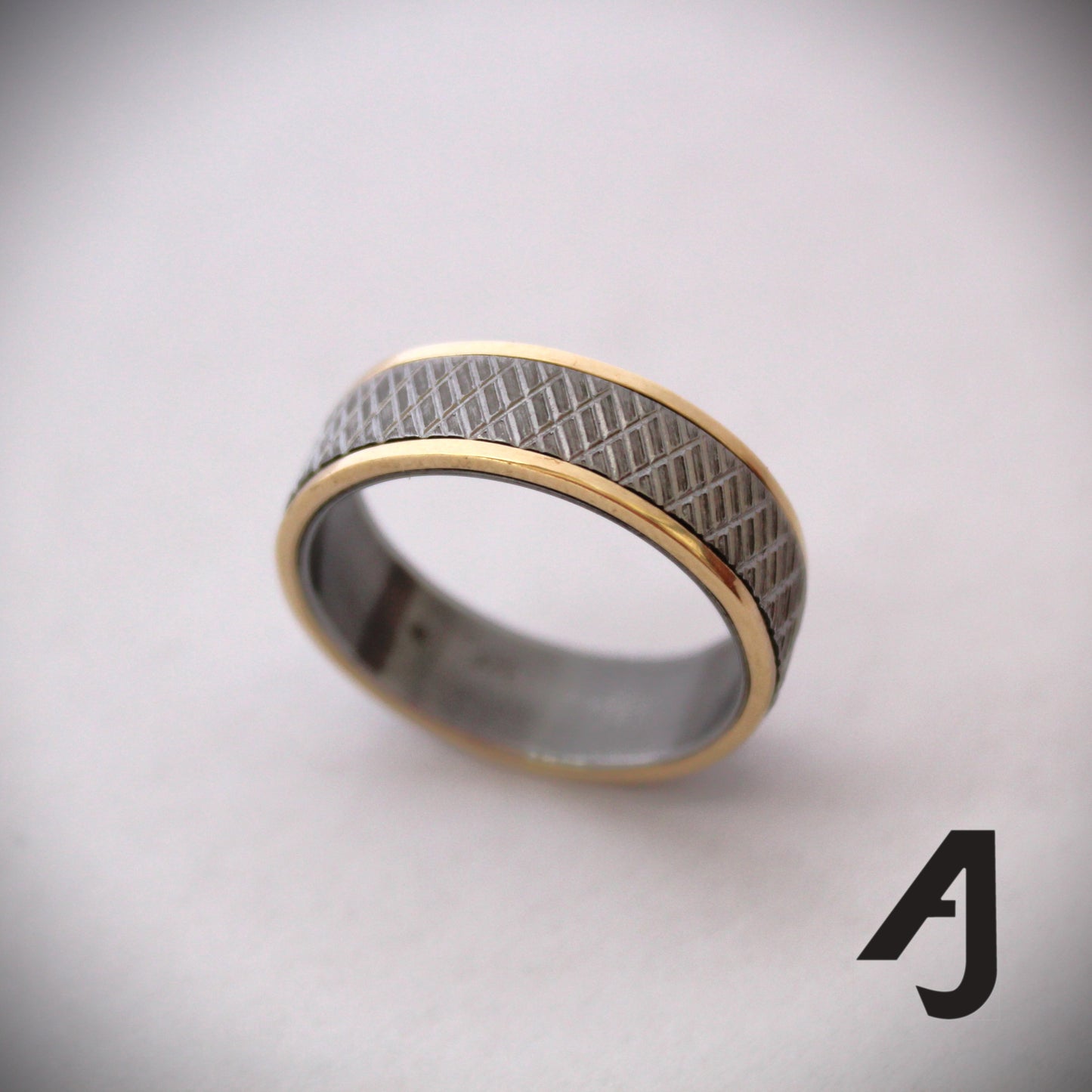 Gold and knurled steel ring