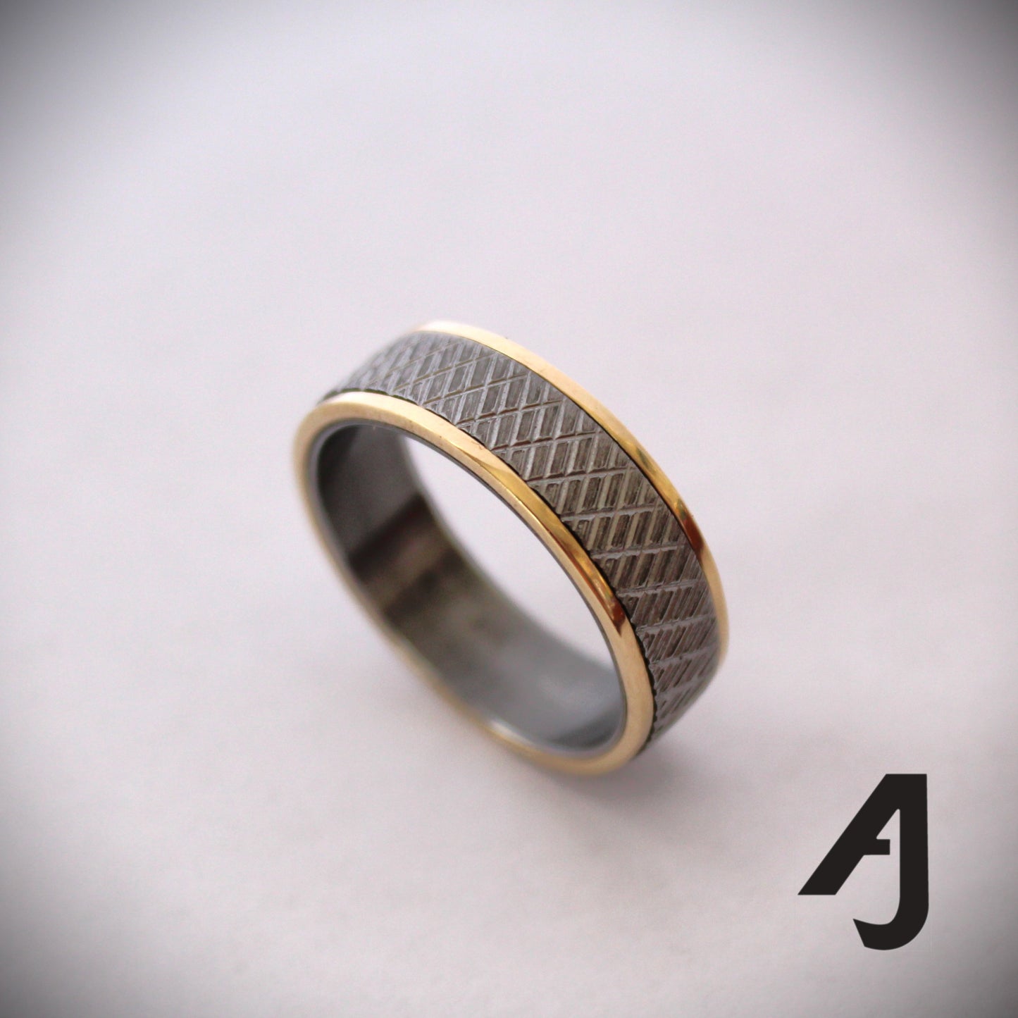 Gold and knurled steel ring