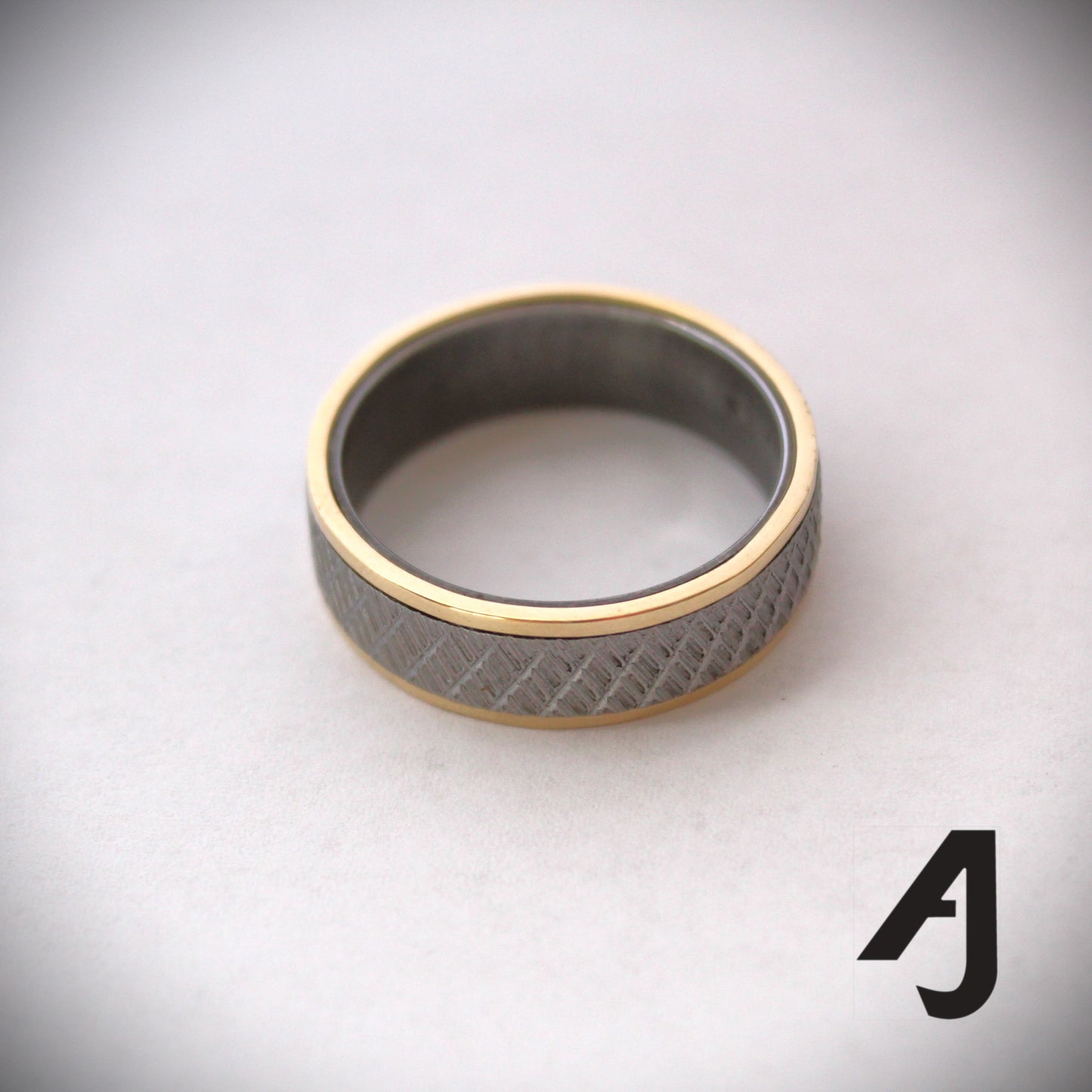 Gold and knurled steel ring