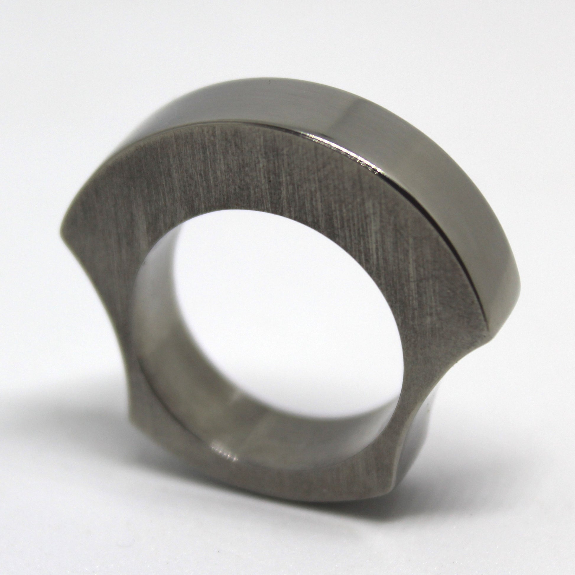 Solid titanium ring ergonomically designed for comfort, featuring a chunky appearance without bulk. Ideal for everyday wear, combining style and functionality for modern jewelry lovers.
